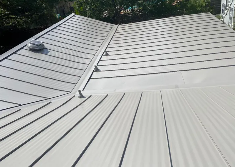 Solar attic fan installed on a metal roof for Roof Ventilation in Los Alamos