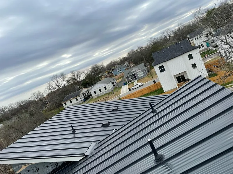 Standing seam metal roof panels with vents for Skylight Repair in Los Alamos